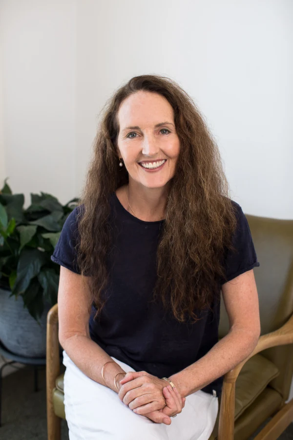 Catherine Stokoe smiling happily at the camera.